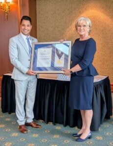 Image of Erin O'Brien Edmonds accepting award 2024 Distinguished Service Award from Morgan Manzer, President of the Nova Scotia Barristers’ Society