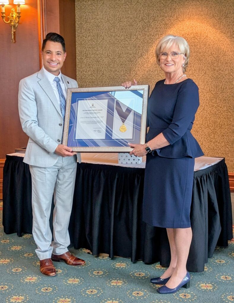Image of Erin O'Brien Edmonds accepting award 2024 Distinguished Service Award from Morgan Manzer, President of the Nova Scotia Barristers’ Society